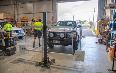 South West Windscreens & Tint workshop in Busselton with ADAS recalibration equipment set up in front of a 4WD vehicle following a windscreen replacement.